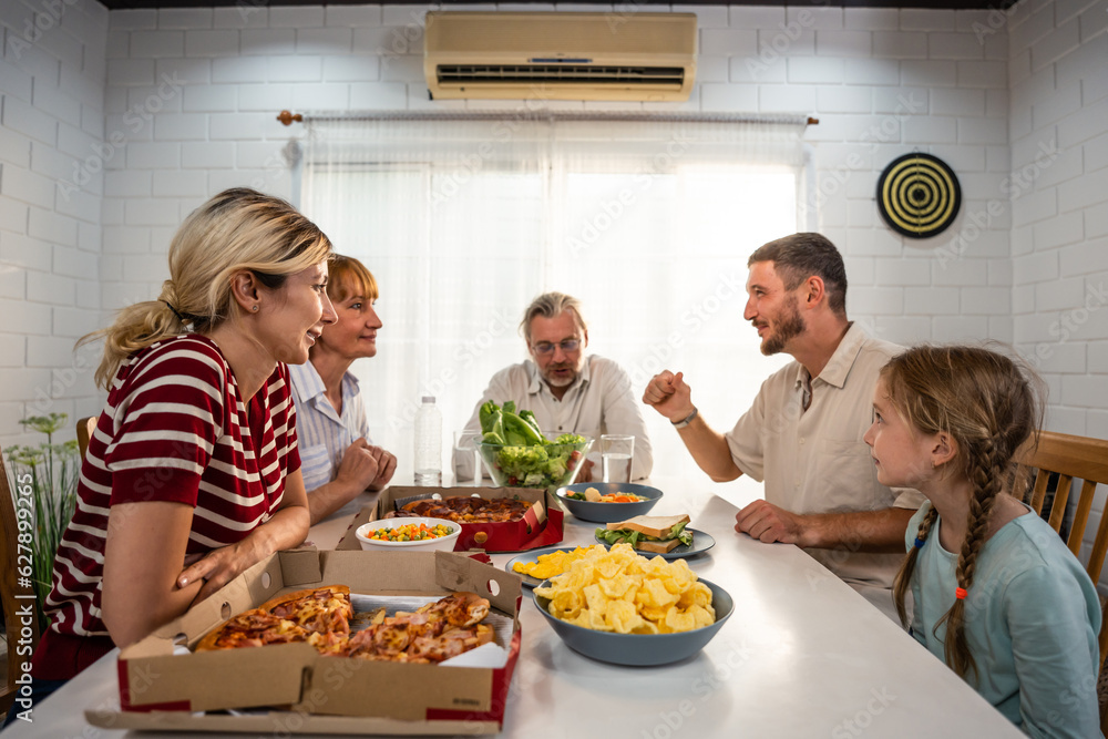 Caucasian lovely family having dinner, enjoying evening party in house. 