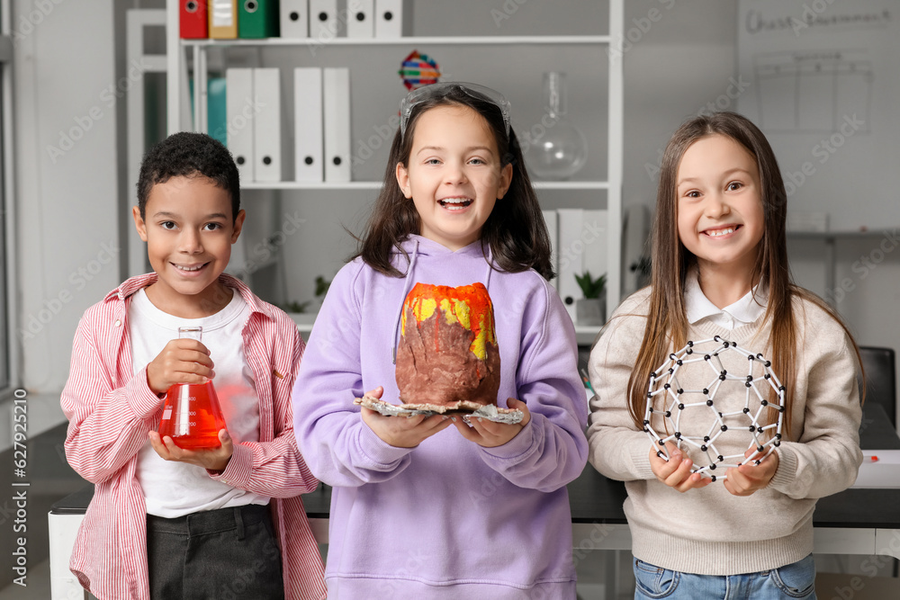 Little children with chemistry equipment in science classroom