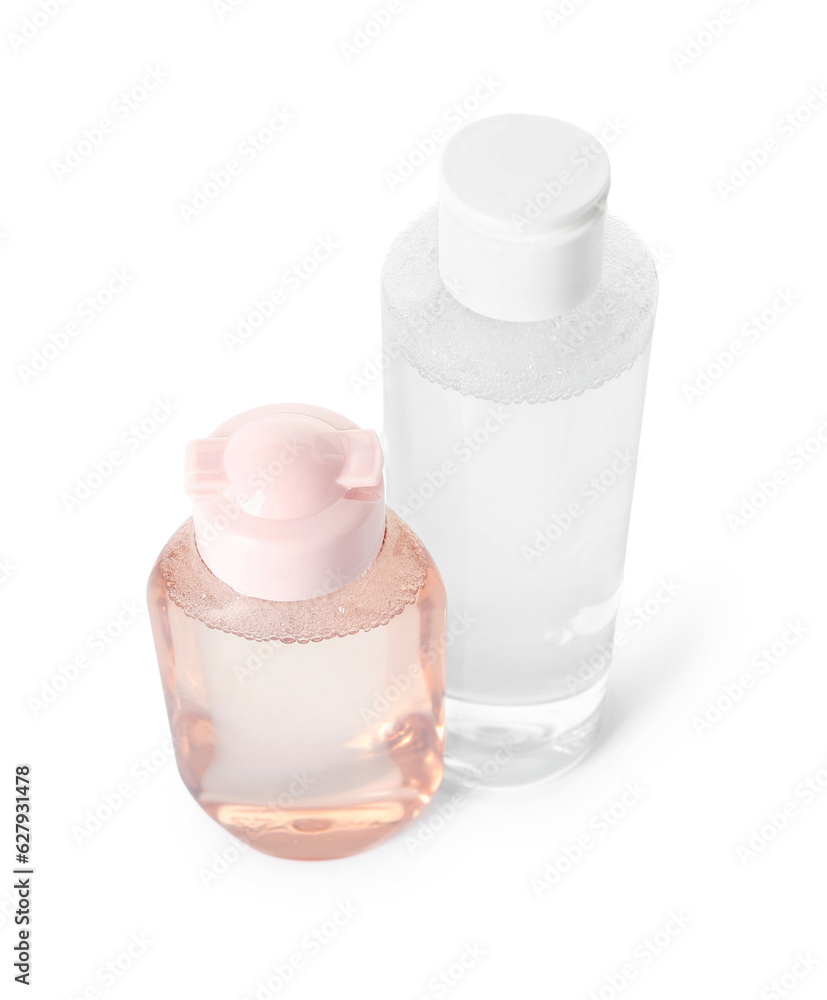 Bottles of micellar water on white background