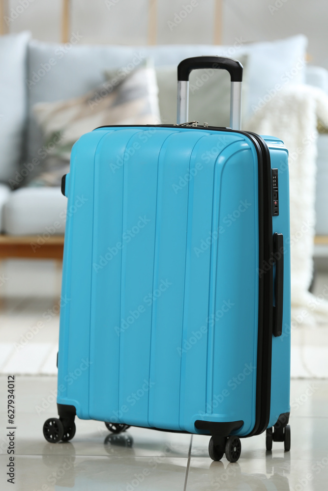 Blue suitcase in living room