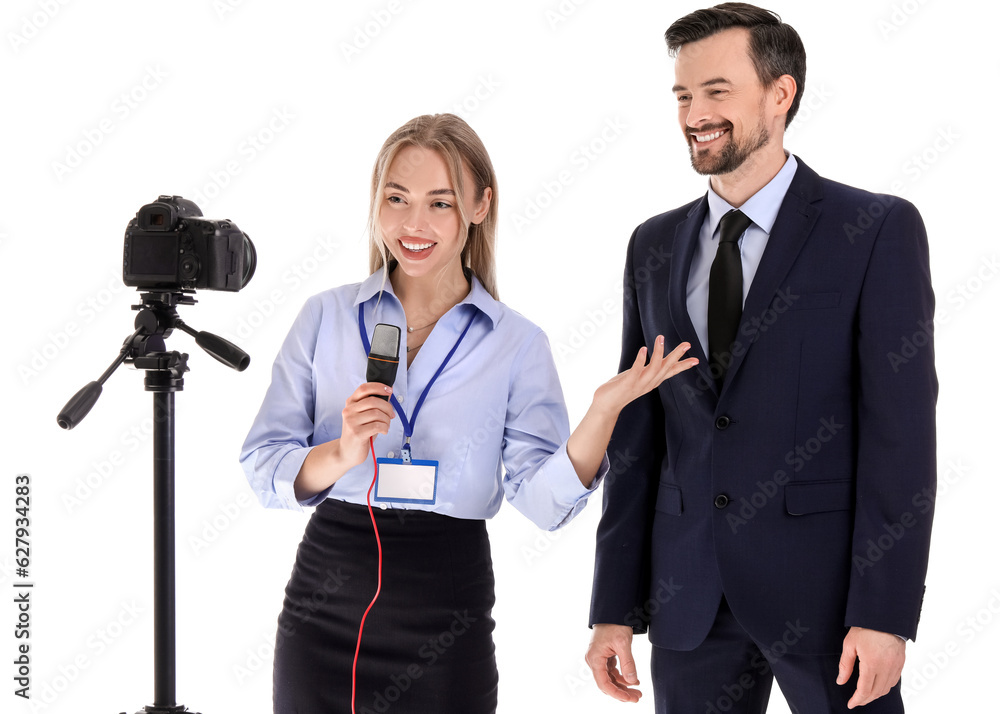 Female journalist with microphone having an interview with businessman on white background