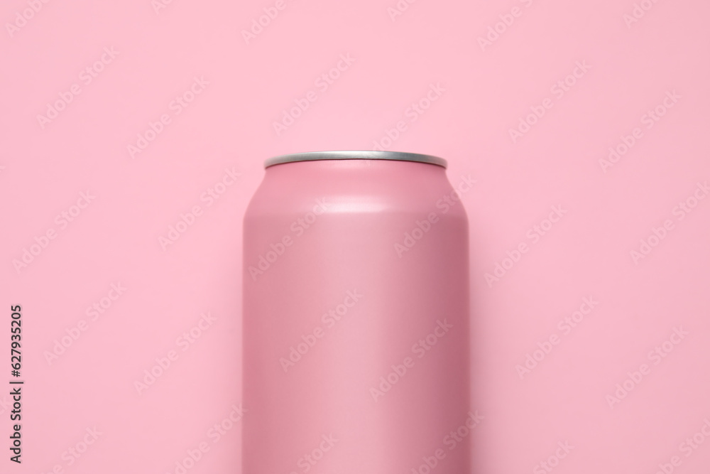 Can of soda on pink background, closeup