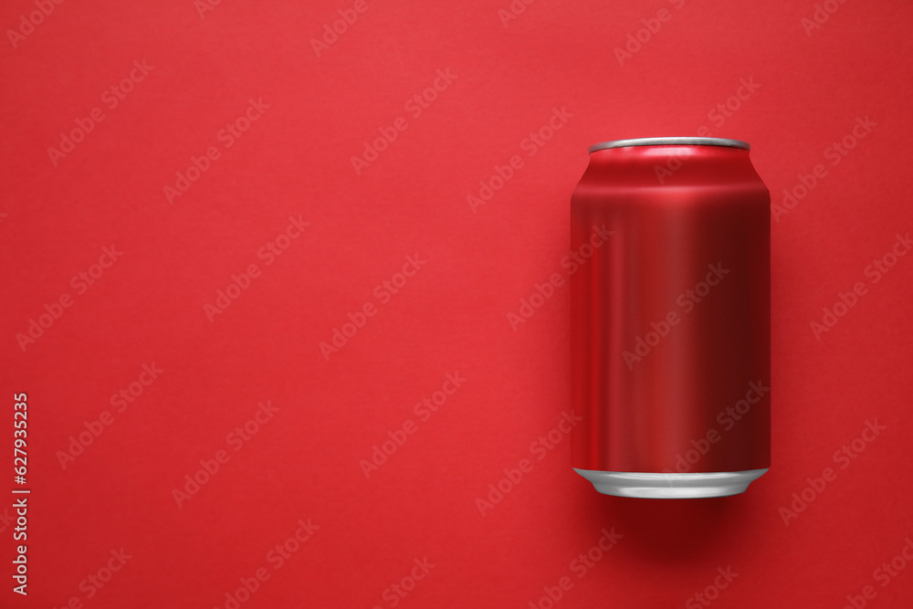 Can of soda on red background