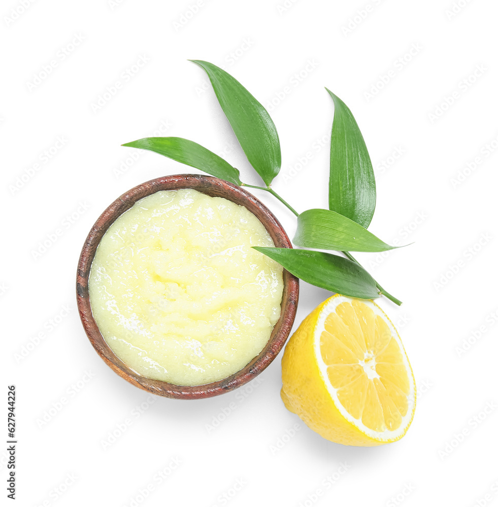 Bowl of lemon body scrub isolated on white background