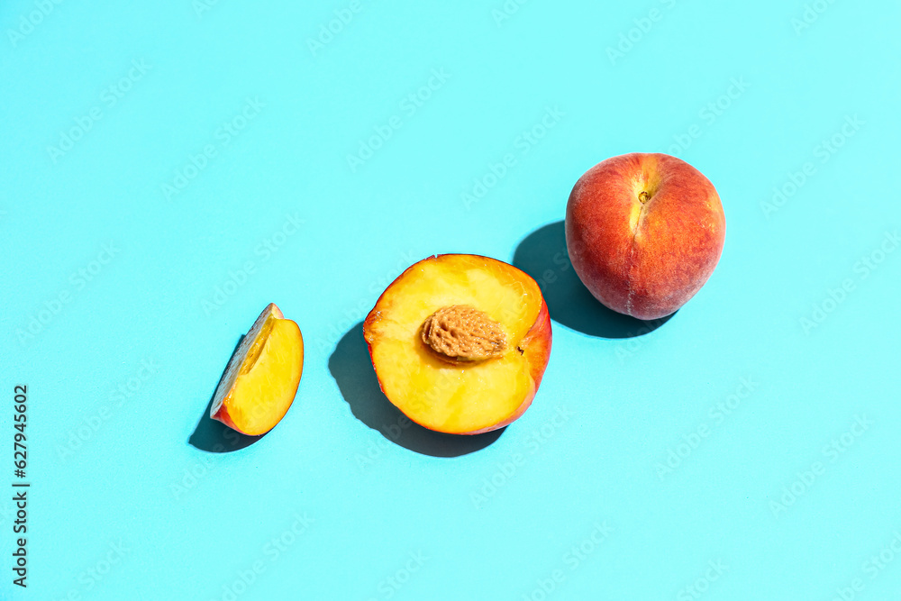 Sweet peaches on blue background