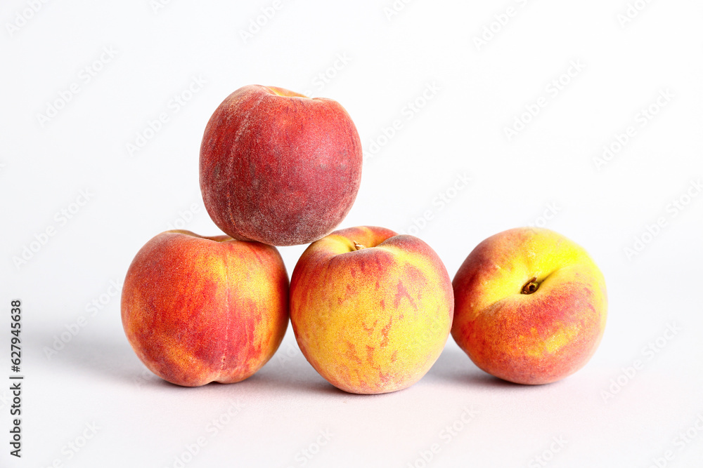 Sweet peaches on white background