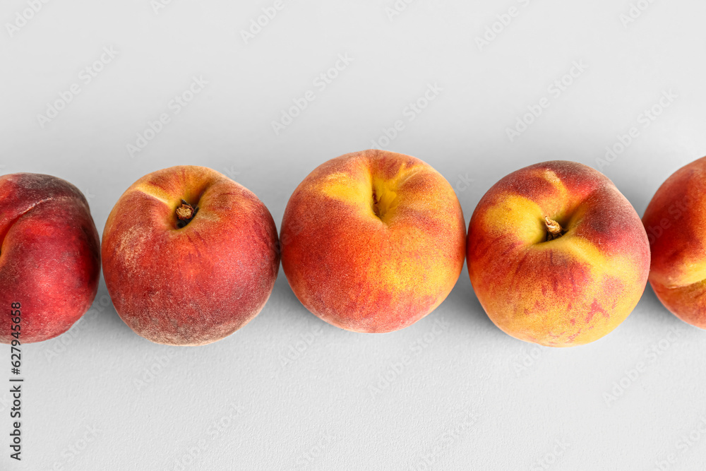 Sweet peaches on white background