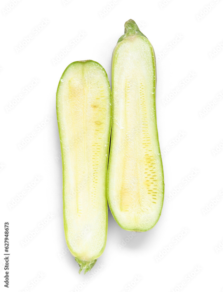 Halves of fresh green zucchini on white background