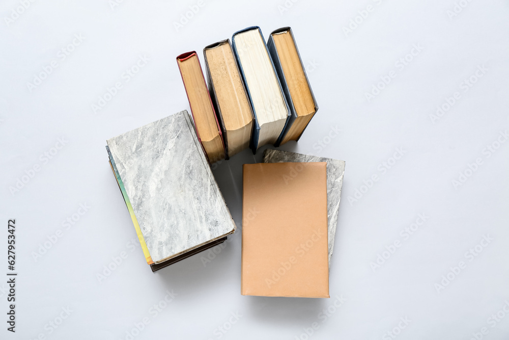 Stack of books on grey background