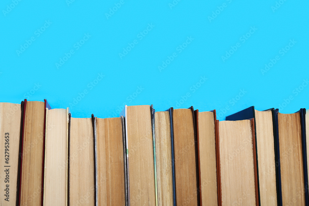 Row of books on blue background