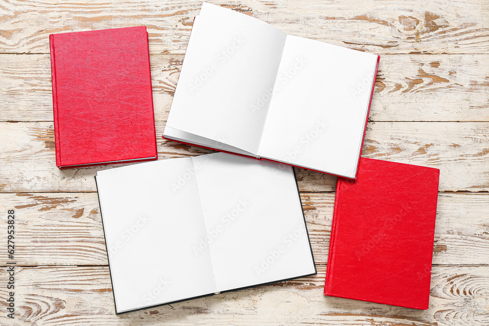 Open books on white wooden table