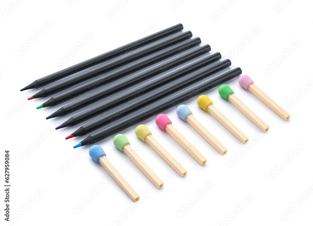 Colorful pencils and erasers in shape of matches on white background