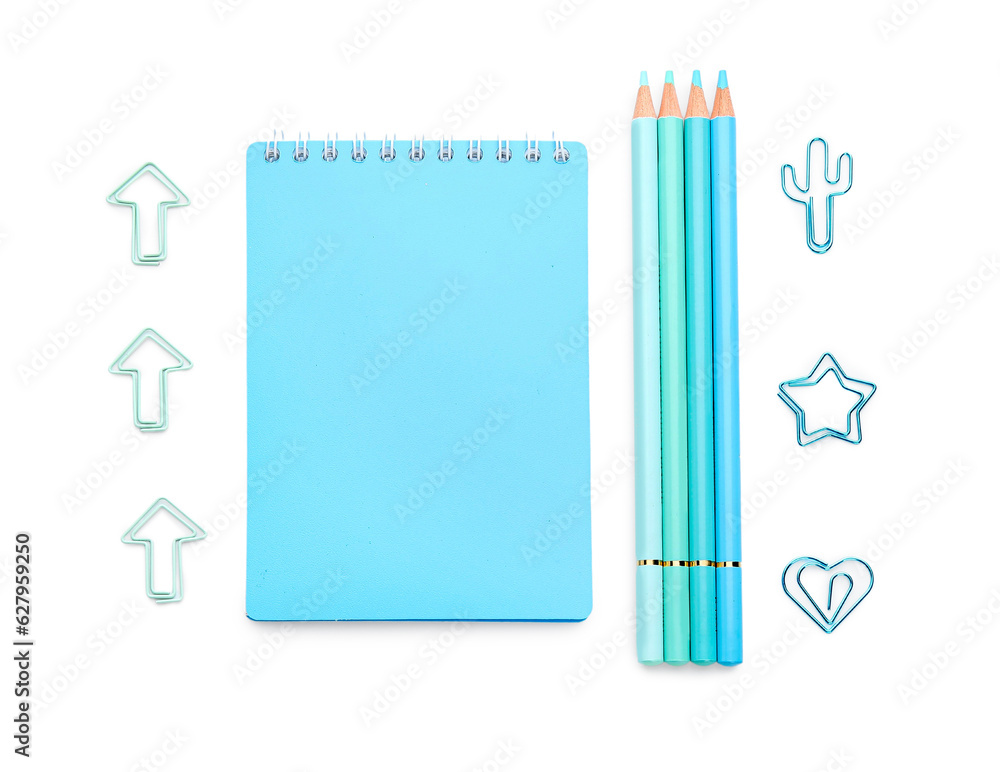 Notebook and school stationery on white background