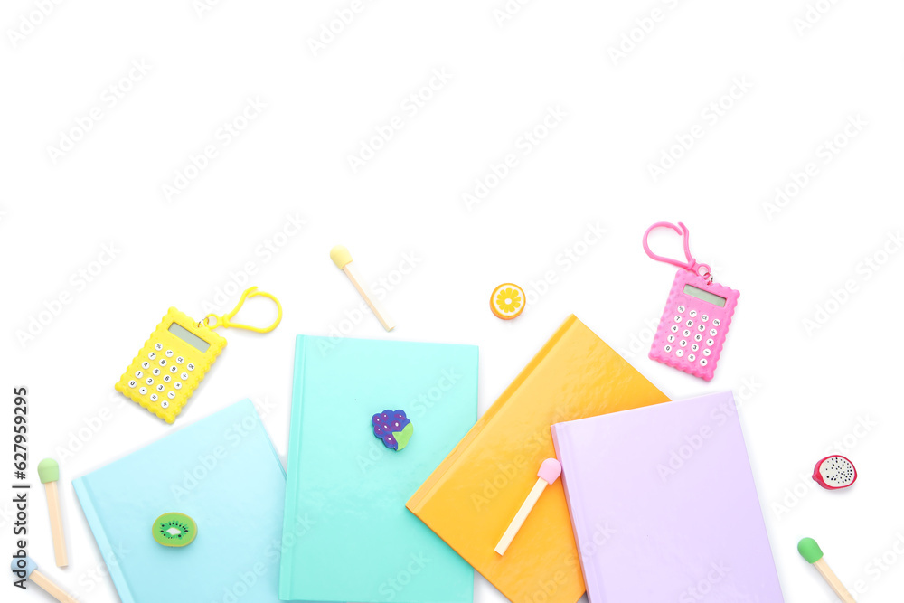 Notebooks and school stationery on white background