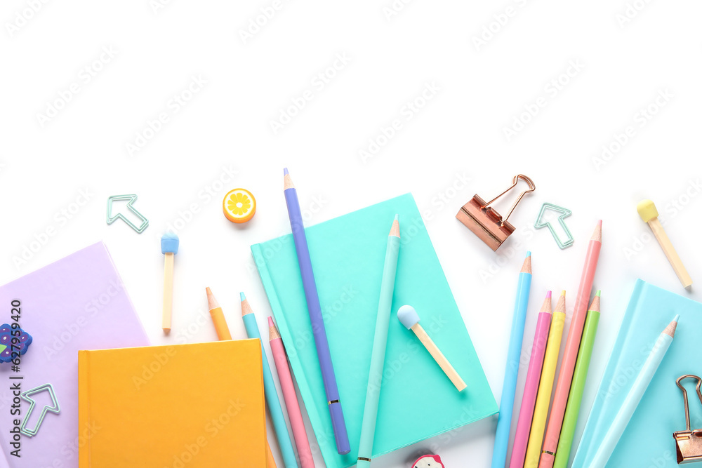 Notebooks and school stationery on white background