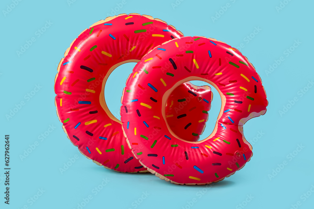 Swim rings in shape of donuts on blue background