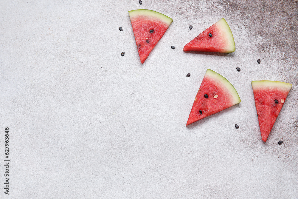 Composition with pieces of ripe fresh watermelon on light background