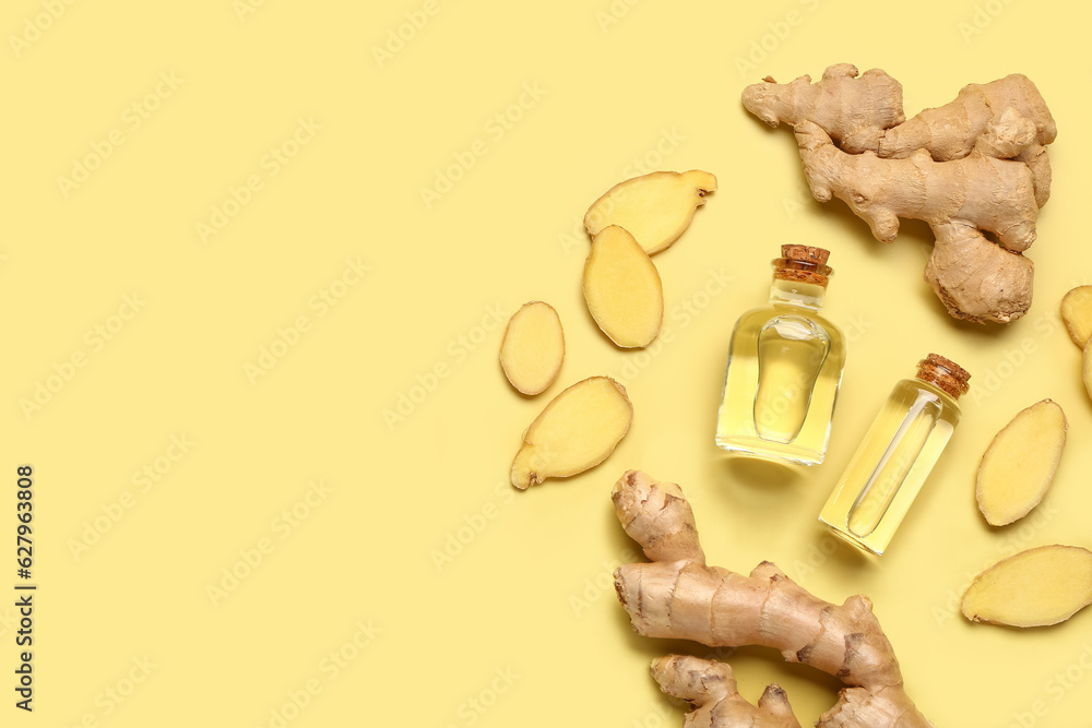 Bottles of ginger cosmetic oil on yellow background