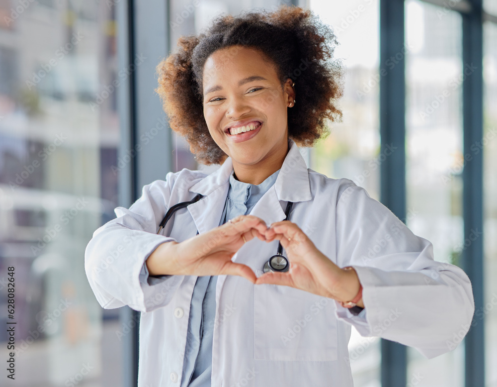 Black woman, heart and hands of doctor in portrait for healthcare, wellness and kindness. Happy fema