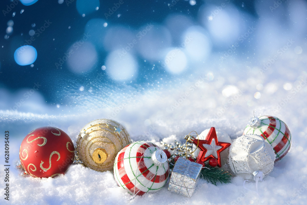 Winter background with Christmas toys in snow, with beautiful light and snow flakes on the blue sky 