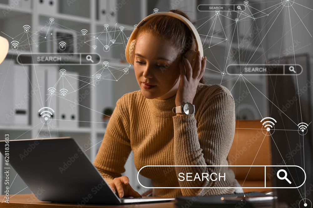 Young woman with laptop using web search engine in evening