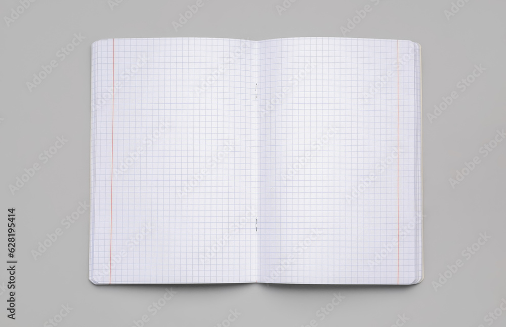 Blank copybook pages on grey background