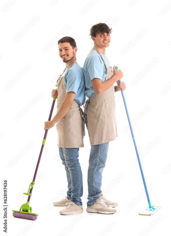 Male janitors with mops on white background