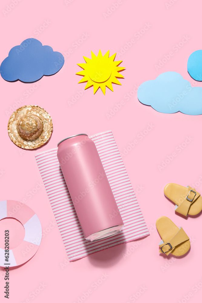 Can of soda with beach decor on pink background