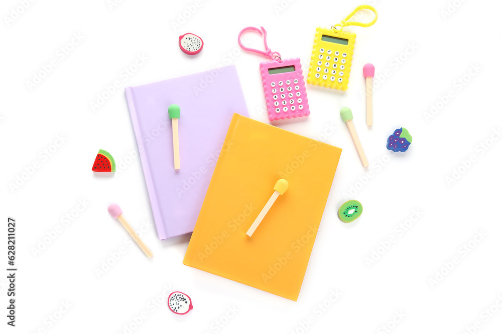 Notebooks and school stationery on white background