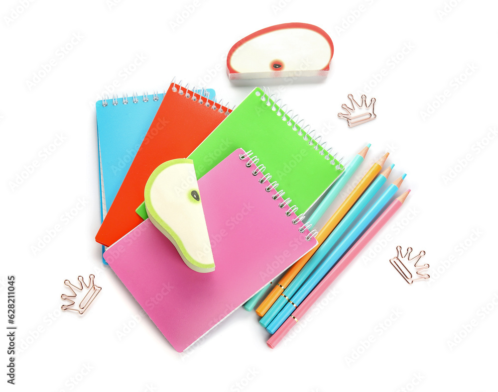 Notebooks and school stationery on white background