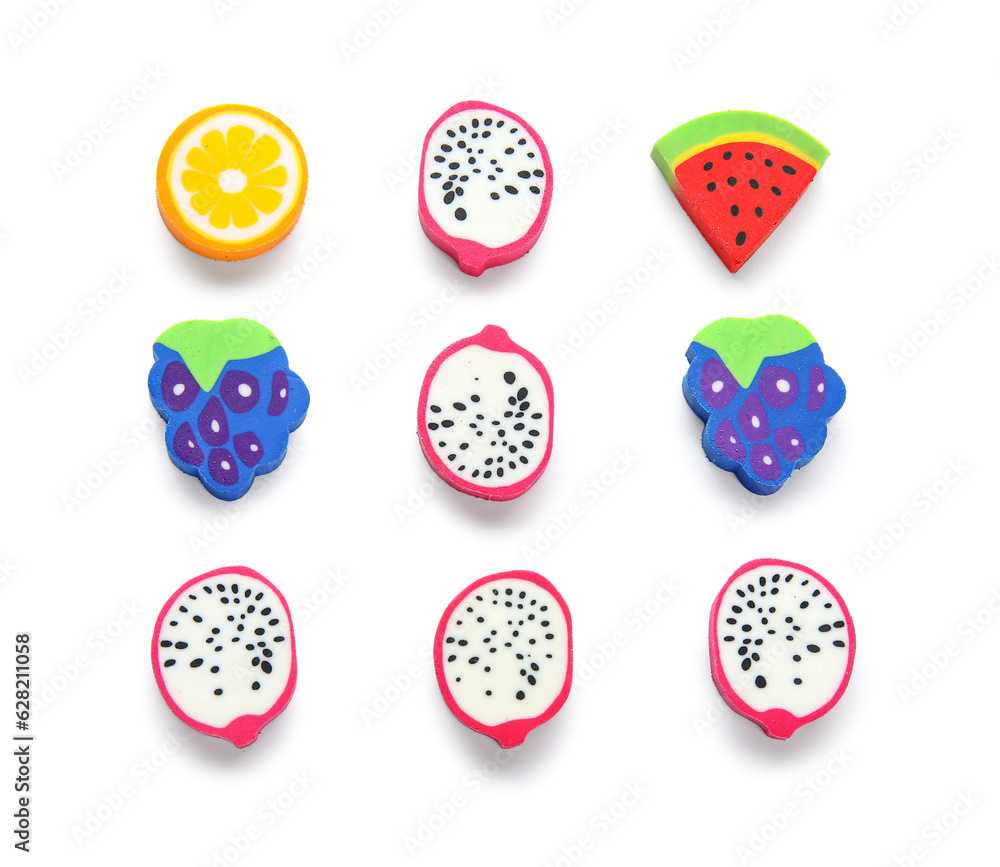 Set of erasers in shape of fruits on white background