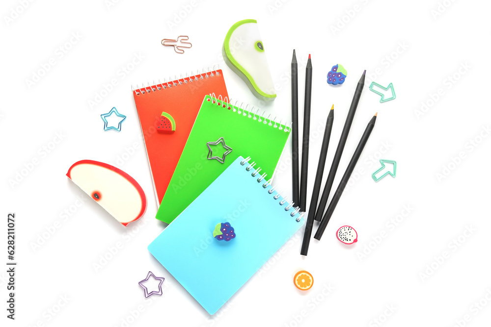 Notebooks and school stationery on white background