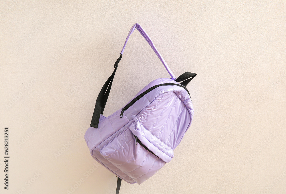 Lilac school backpack on light background