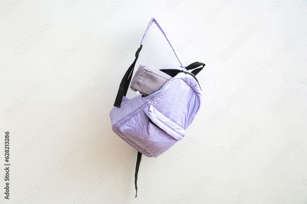 Lilac school backpack with pencil case on white background