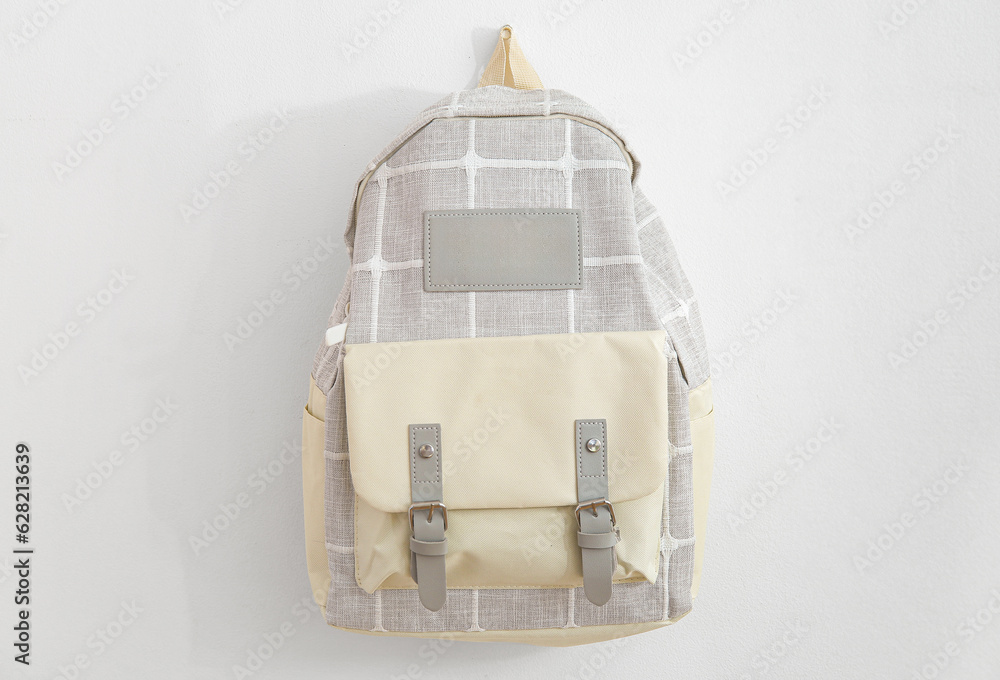 Grey school backpack on white background