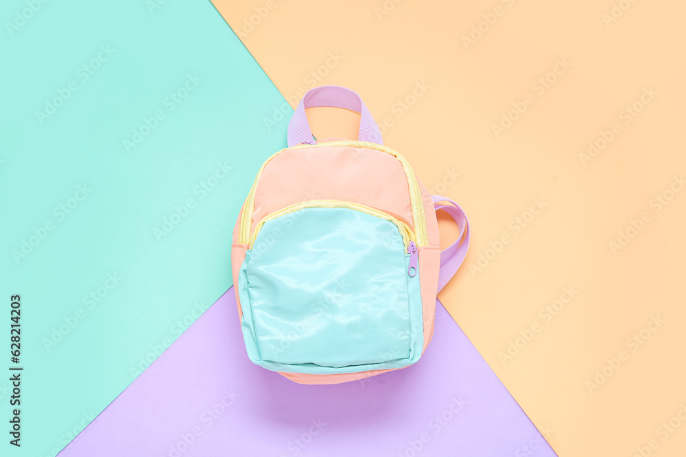 Stylish school backpack on color background