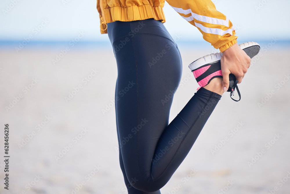 Woman, fitness and stretching legs for workout, training or outdoor running on the beach. Female per