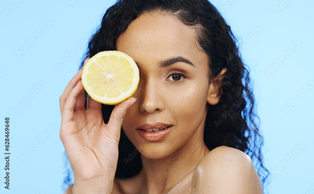 Lemon, face skincare and beauty of woman in studio, vegan wellness or blue background. Model, portra