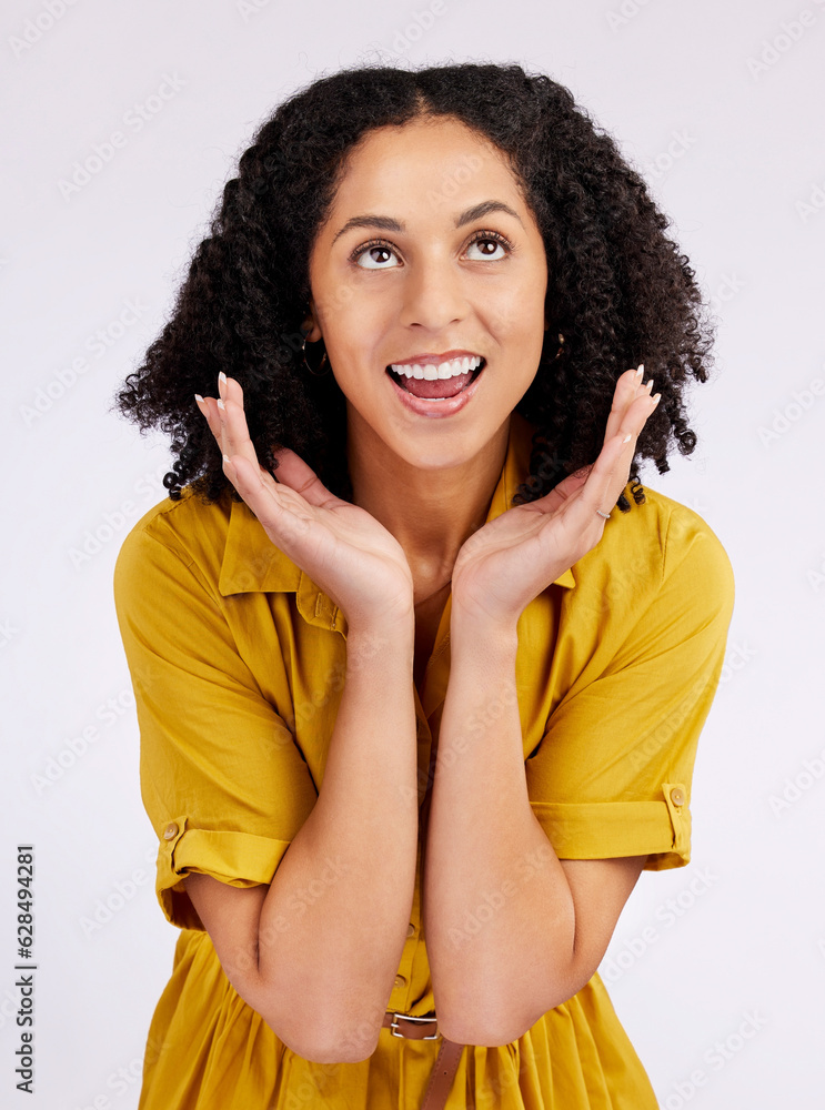 Wow, surprise and hands on face of woman in studio looking up for info, promo or news on white backg