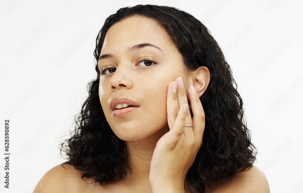 Face, beauty and makeup with a woman in studio isolated on a white background touching her skin. Por