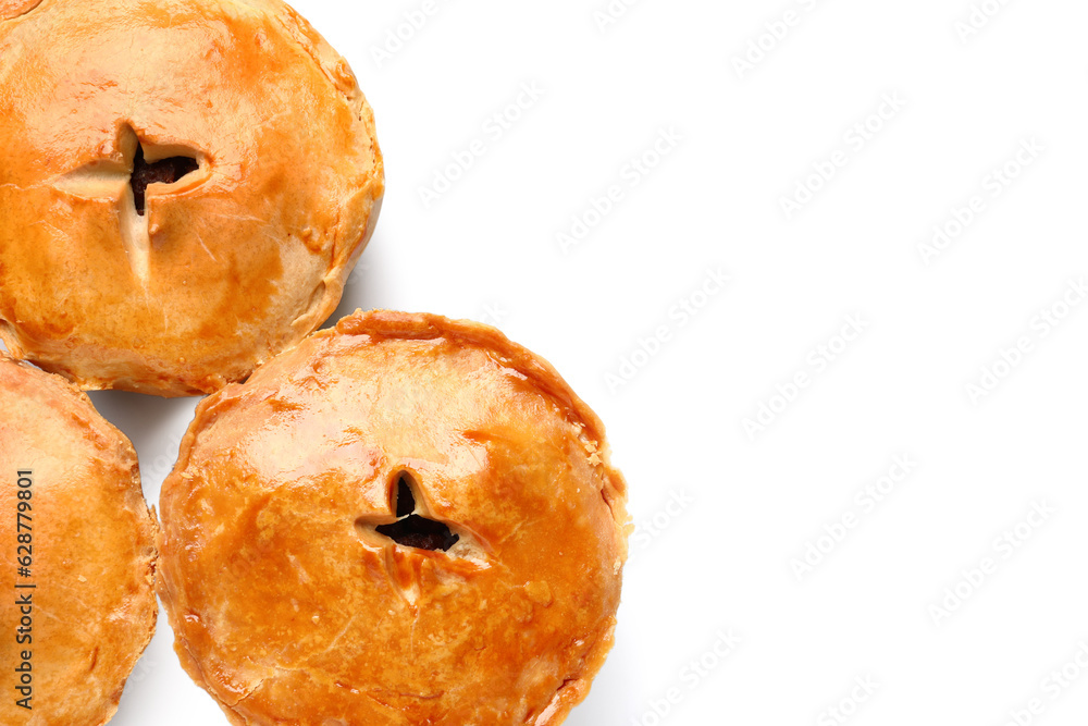 Tasty meat pot pies on white background