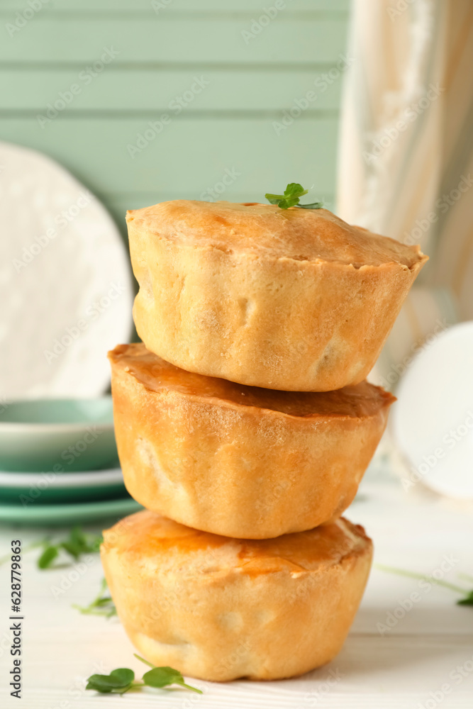 Tasty meat pot pies on table