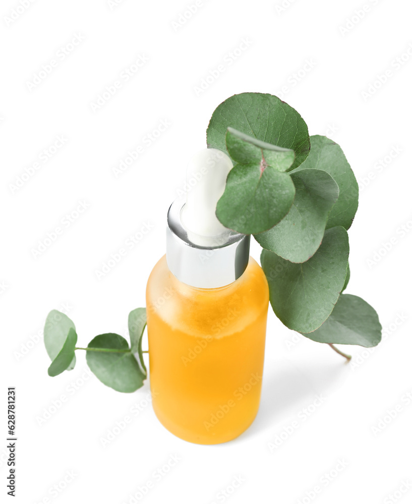 Bottle with cosmetic oil and eucalyptus branch on white background