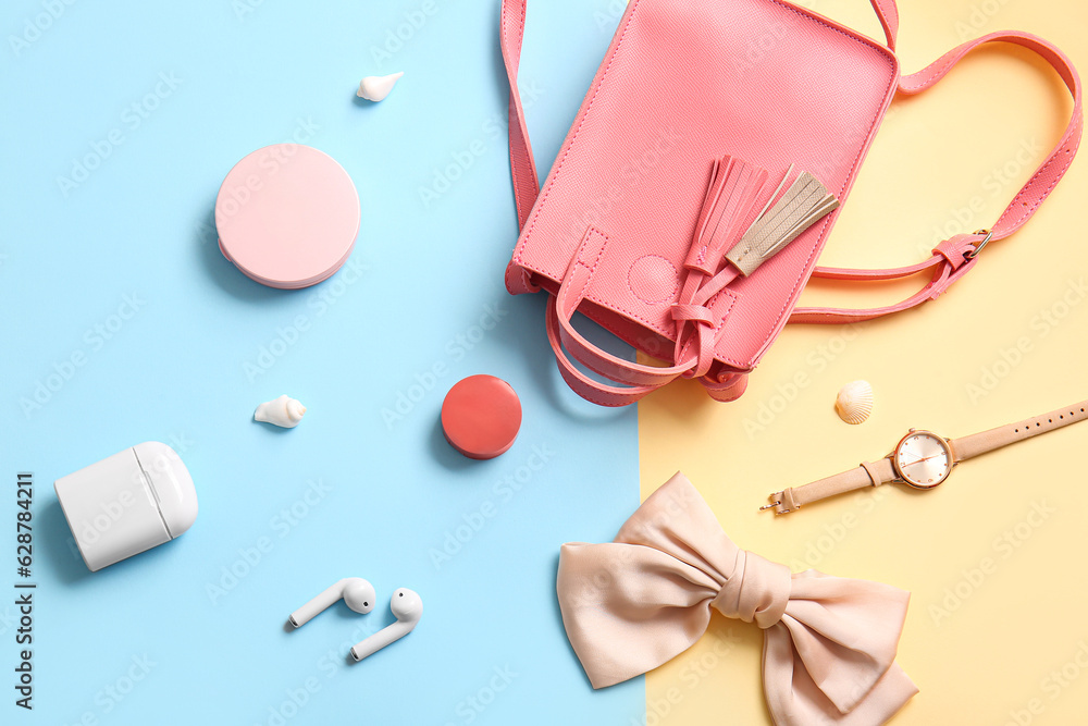 Stylish bag and different accessories on colorful background