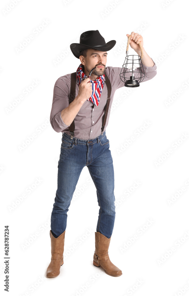 Handsome cowboy with lantern and smoking pipe on white background