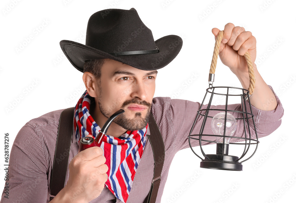 Handsome cowboy with lantern and smoking pipe on white background, closeup