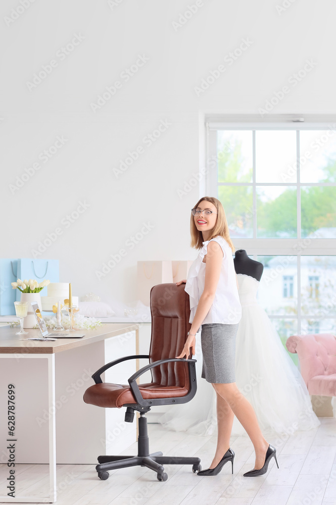 Female wedding planner working in office