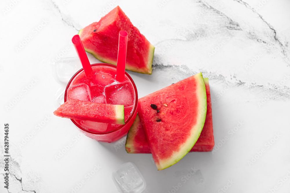 Glass of tasty watermelon fresh on white marble background