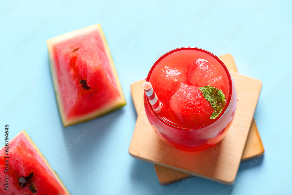 Glass of tasty watermelon fresh on blue background