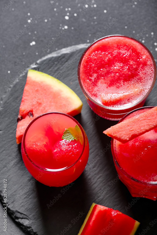 Glasses of tasty watermelon fresh on black background